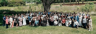 Large group shot of Daly Seven team outside in grass